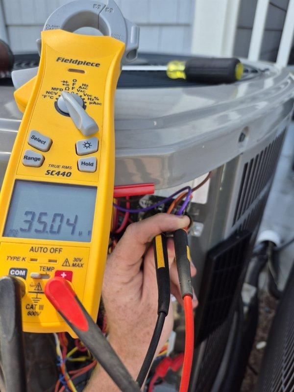 Performed seasonal cooling system maintenance and diagnostics on outdoor condensing unit. Used digital multimeter to measure electrical parameters, recording capacitor readings and verifying proper voltage and amperage levels across system components. All electrical connections inspected and tested, system operating within normal specifications upon completion.