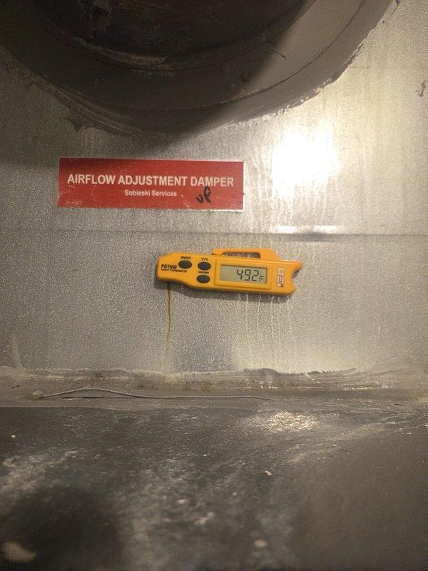 Performed preventive maintenance on cooling system, including temperature diagnostics at supply plenum registering 49.2°F and electrical measurements showing 0.9 amp draw at blower motor assembly. Inspected airflow adjustment damper, ductwork insulation, and drain pan condition; all components found operational with no immediate service needs identified.