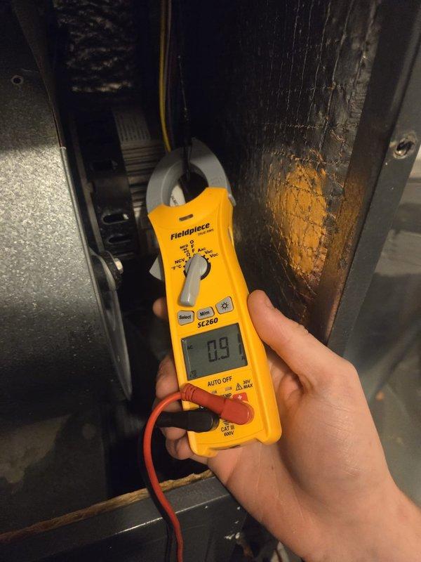 Performed preventive maintenance on cooling system, including temperature diagnostics at supply plenum registering 49.2°F and electrical measurements showing 0.9 amp draw at blower motor assembly. Inspected airflow adjustment damper, ductwork insulation, and drain pan condition; all components found operational with no immediate service needs identified.