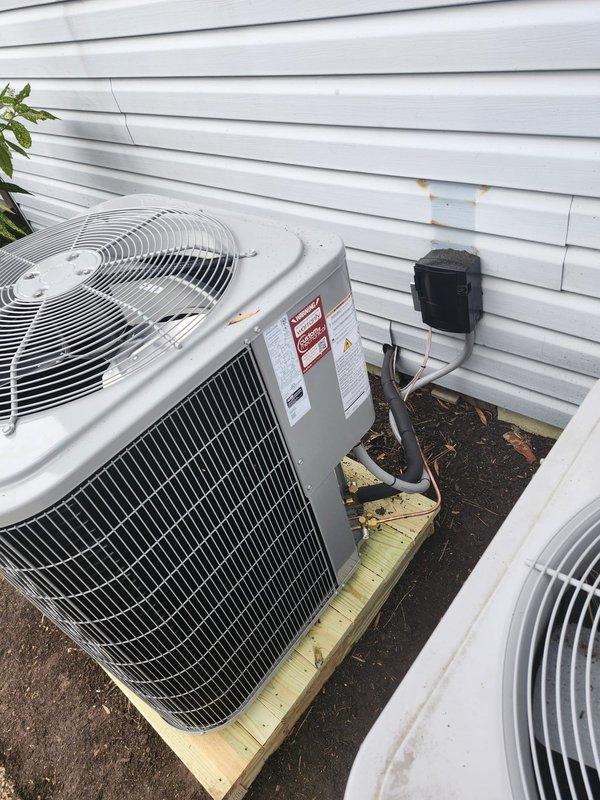 Completed full HVAC system replacement including removal and disposal of existing equipment. Installed new Carrier 27SCA530A003 2.5-ton 15 SEER heat pump outdoor unit on pressure-treated wood platform, Carrier FJ5ANXB30L00 air handler, and Carrier FF2601C10 10kw electric heat pack. Fabricated and installed metal duct transitions to adapt new equipment to existing ductwork. Replaced outdoor disconnect and electrical whip while reusing existing condensation lines and power supply. Installed Honeywell TH6320WF digital WiFi thermostat for system control. Performed system startup, tested all electrical connections and refrigerant levels, and verified proper operation of heating and cooling modes. Unit filter installed at air handler location. System commissioned and left in full working order with one-year parts warranty from installation date.