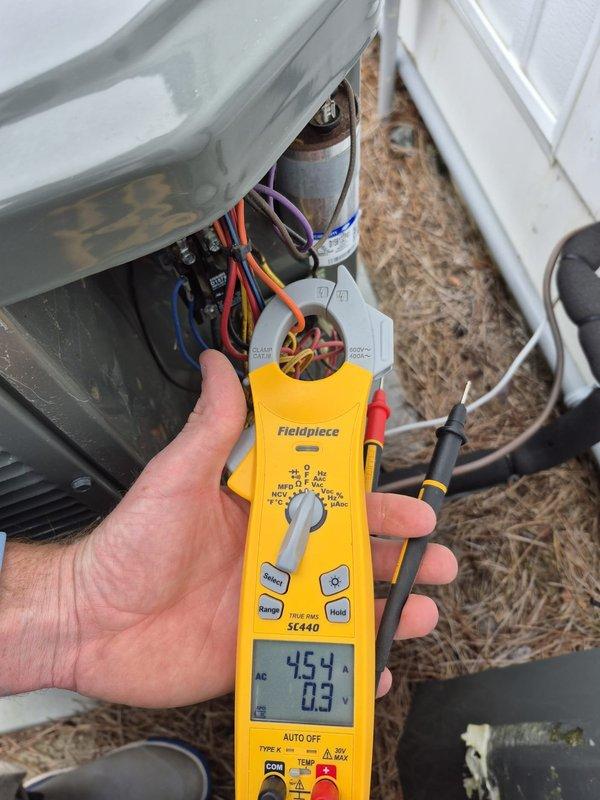 Performed comprehensive tune-up and inspection on residential HVAC system. Used clamp meter to verify electrical parameters including amperage draws and voltage readings at both the outdoor condensing unit and indoor air handler, confirming all measurements within manufacturer specifications. All system components operating properly with no deficiencies noted.
