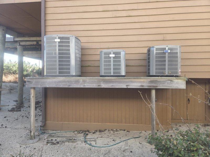 Removed and disposed of existing first floor HVAC system from elevator machine room. Installed 5A6H4030 2.5 ton heat pump outdoor unit on existing concrete platform and applied Infiniguard salt air protective coating to exterior surfaces. Installed electrical whip and disconnect for outdoor unit. Mounted 5TEM6B03 variable speed fan coil unit with BAYHTR1510 10KW electric heater and breaker in attic space. Flushed, pressure tested, and recharged existing refrigeration lines to verify system integrity and proper refrigerant charge. Installed TH6320WF WiFi-enabled programmable thermostat for remote temperature control and monitoring. Verified all electrical connections, tested system operation in heating and cooling modes, and confirmed proper airflow through ductwork. Extended maintenance contract coverage for one additional year on all three systems in residence.