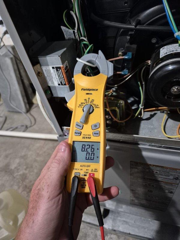 Completed routine cooling maintenance visit on residential HVAC system. Inspected and documented air filter condition in attic-mounted air handler, verified proper filter installation and airflow. Performed electrical diagnostics on condensing unit using clamp meter, measured compressor amperage at 83.6 amps, checked wiring connections, and verified all components operating within normal parameters.