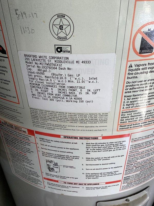 Responded to service call for gas water heater with reported slow leak in garage. Upon inspection, evaluated 48-gallon Bradford White LP gas water heater with expansion tank installed. Assessed unit condition, examined copper supply piping connections, flexible connector, and PVC venting system for leak source. Documented equipment specifications including 65,000 BTU/hr input rating and current operational status. Photographed water heater installation, labeling, and surrounding plumbing configuration. Provided estimate for tank-style gas water heater replacement options to address leak issue.
