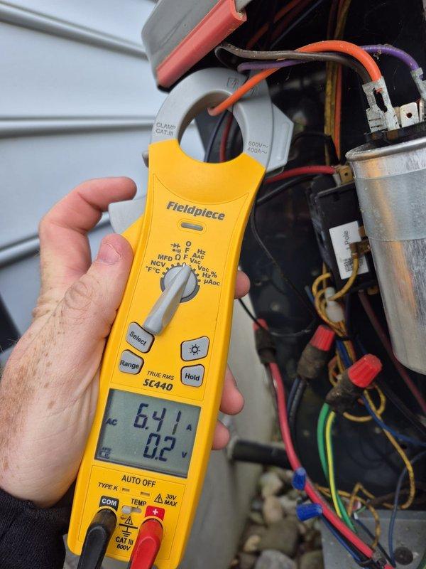 Completed preventative maintenance cool check on two HVAC systems. Performed electrical diagnostics using clamp meter, recording amperage draw of 6.41A on compressor circuit. Inspected electrical connections, capacitor, and wiring integrity within condensing unit. Applied foil-grip mastic sealant to ductwork connections as needed. All systems operational and running within normal parameters upon completion.