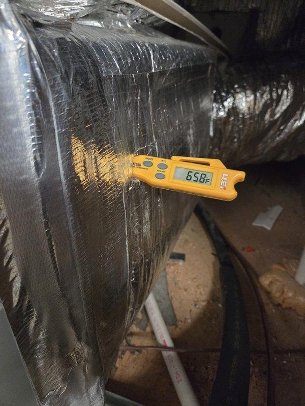 Completed routine cooling maintenance visit for residential HVAC system. Performed temperature diagnostics on supply ductwork in crawlspace area, recording readings of 65.8°F and verifying proper airflow through insulated duct runs. Inspected ductwork insulation integrity and confirmed system operating within normal parameters for cooling season preparation.