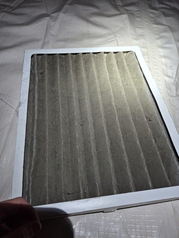 Performed cooling system maintenance and inspection on residential HVAC unit. Replaced heavily soiled air filter that showed significant dust and debris accumulation, which was restricting airflow and reducing system efficiency. Inspected internal components including compressor assembly, refrigerant lines, and electrical connections through access panel—all components found to be in proper working condition with no immediate service needs identified.