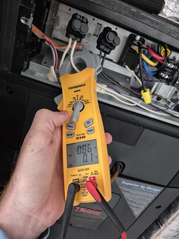 # HVAC Maintenance - Cooling 2 Systems

Completed preventive maintenance cooling visit on dual HVAC system. Performed electrical diagnostics using clamp meter at control panel, verifying amperage draws and voltage readings on system components. Addressed multiple system alerts displayed on ecobee smart thermostat, including low temperature alert and furnace/boiler problem notifications that had occurred over previous weeks. Inspected wiring connections at electrical panel, noting proper termination of multiple conductors on terminal blocks. Verified system operational status and cleared alert conditions. All electrical measurements recorded within acceptable parameters for continued system operation.