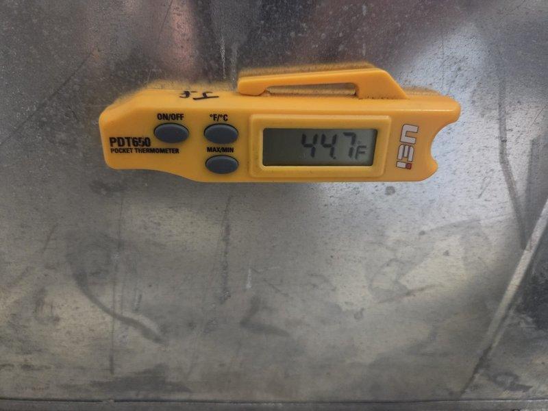 Performed routine Cool Check maintenance on HVAC system with 410A refrigerant. Verified system operation and recorded supply air temperature at 44.7°F, confirming proper cooling performance. Inspected evaporator coil and surrounding components, documenting conditions with photos for service records.