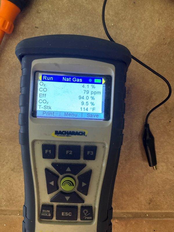 Removed and disposed of existing furnace equipment. Installed new Carrier 59SC2E080M17 high-efficiency 92% AFUE 80,000 BTU gas furnace with LP conversion kit. Fabricated and installed metal duct transitions to adapt new unit to existing ductwork. Reused existing electrical connections, condensate drain lines, and gas supply piping. Installed Honeywell digital standard thermostat for system control. Performed combustion analysis testing confirming optimal efficiency at 94.0%, oxygen level at 4.1%, carbon monoxide at 79 ppm, carbon dioxide at 9.5%, and stack temperature at 114°F. Verified draft pressure reading at 9.81 inches water column. System tested and operating within manufacturer specifications with one-year warranty coverage from installation date.