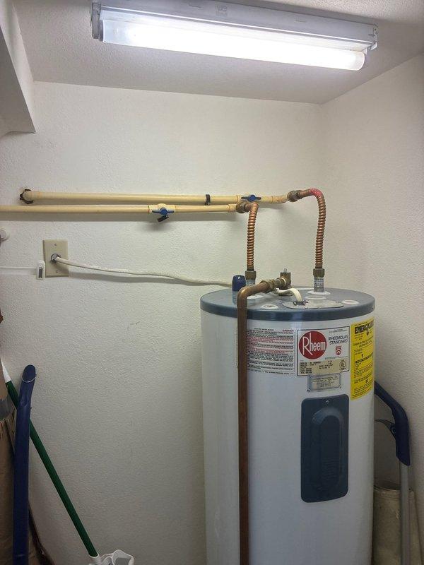 Completed de-winterization of off-season water system, restoring full plumbing functionality to the property. Inspected and documented existing Rheem water heater installation, including all copper supply lines, corrugated flexible connectors, shutoff valves, and electrical connections. Captured detailed photographs of water heater condition and mechanical room setup to provide comprehensive documentation for future water heater replacement estimate.
