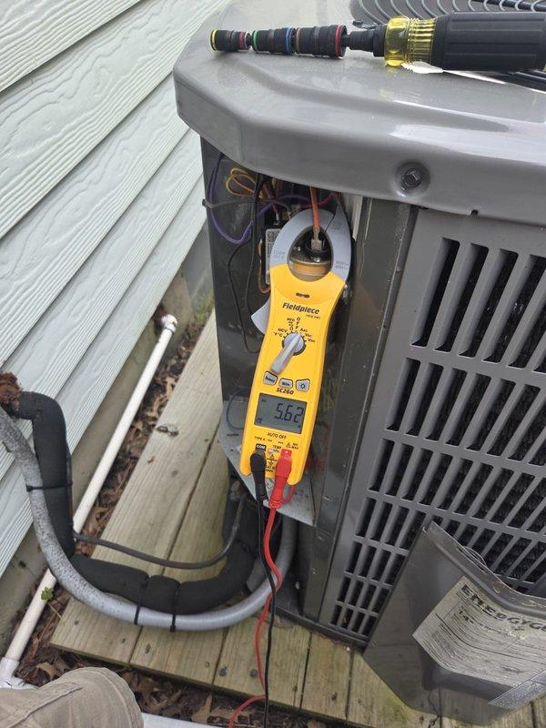 Completed comprehensive cooling system inspection on single outdoor condensing unit. Performed diagnostic testing using digital multimeter to measure system temperatures and electrical parameters, with recorded readings of 5.6°C on refrigerant line and 79.4°F ambient conditions. Verified proper operation of all components, inspected refrigerant line connections and insulation integrity, and confirmed electrical connections were secure. System found operating within normal parameters with no issues identified.