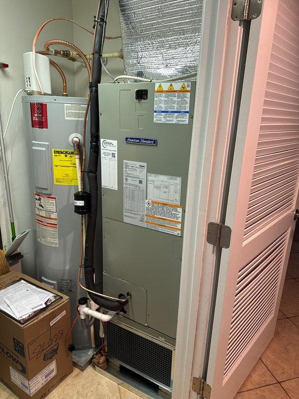 Completed full HVAC system replacement including removal and disposal of existing equipment. Installed American Standard 5A6H4036A1000A 3-ton 14 SEER heat pump condenser on rooftop using crane service, along with American Standard 5TEM4B03AC31 air handler in interior utility closet. Added American Standard BAYHTR1510 10kW electric heat pack and BAYSF1185 18.5" filter rack to air handler assembly. Fabricated and installed metal duct transitions to adapt new equipment to existing ductwork. Reused existing refrigerant lines and condensate drain lines where applicable. Replaced outdoor electrical disconnect and electrical whip to meet current code requirements. Installed Honeywell TH6320WF digital WiFi thermostat for system control. System tested and operational with one-year parts warranty from installation date.