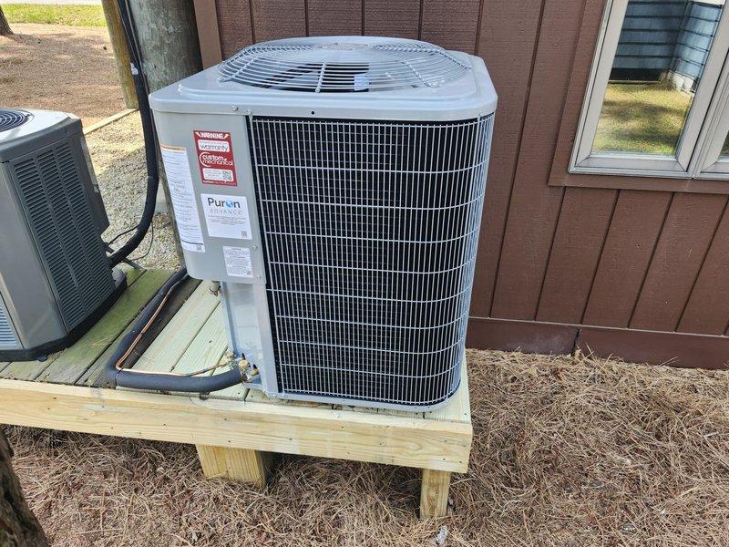 Completed full HVAC system replacement including removal and disposal of existing equipment. Installed new Carrier 27SCA530A003 2.5-ton 15 SEER heat pump outdoor unit on pressure-treated wood platform. Installed Carrier FJ5ANXB30L00 air handler with Carrier FF-2601C10 10kW electric heat pack. Fabricated and installed metal duct transitions to adapt new equipment to existing ductwork. Reused existing refrigerant lines and condensate drain. Replaced outdoor electrical disconnect and whip to meet current code requirements. Installed Honeywell TH6320WF digital WiFi thermostat for system control. Verified proper system operation, refrigerant charge, and airflow upon startup.