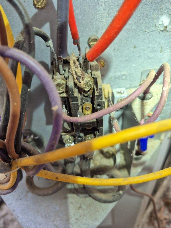 Responded to no cooling complaint at residence with new homeowners unfamiliar with system operation. Upon arrival, performed complete system diagnostic including inspection of outdoor contactor unit which showed significant age-related wear, corrosion, and deteriorated wiring insulation. Verified electrical panel breaker configuration and proper circuit protection. Educated homeowner on air filter location, proper sizing, and routine maintenance requirements for their HVAC system to ensure optimal performance and longevity.