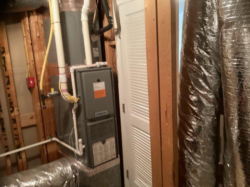 Evaluated 20-year-old furnace system located in upstairs closet for repair versus replacement options after inducer motor failure was identified. Conducted comprehensive assessment of unit condition, documented equipment with photos, and provided repair estimate for inducer motor replacement with part available in stock.