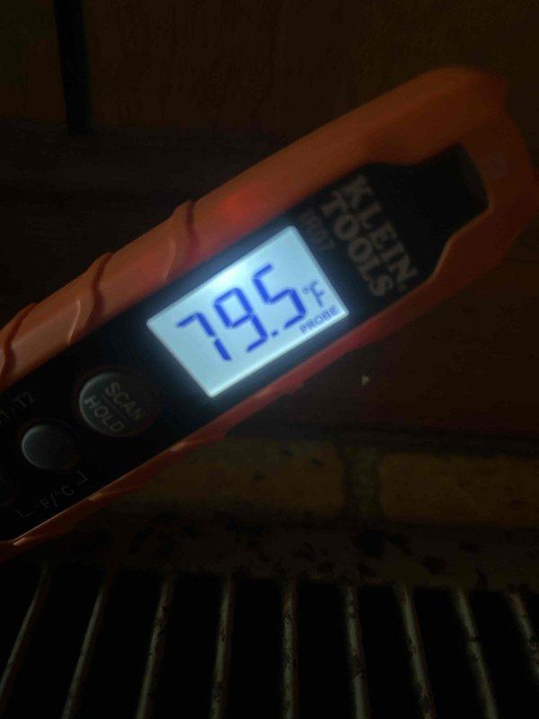 Responded to no heat call with complaint of outdoor unit making loud unusual noise. Upon arrival, measured supply air temperature at 79.5°F, confirming lack of heating. Inspected outdoor heat pump unit and found deteriorated refrigerant line insulation and loose copper refrigerant piping creating vibration and noise during operation. Secured refrigerant lines and recommended insulation replacement to prevent future efficiency loss and continued noise issues.