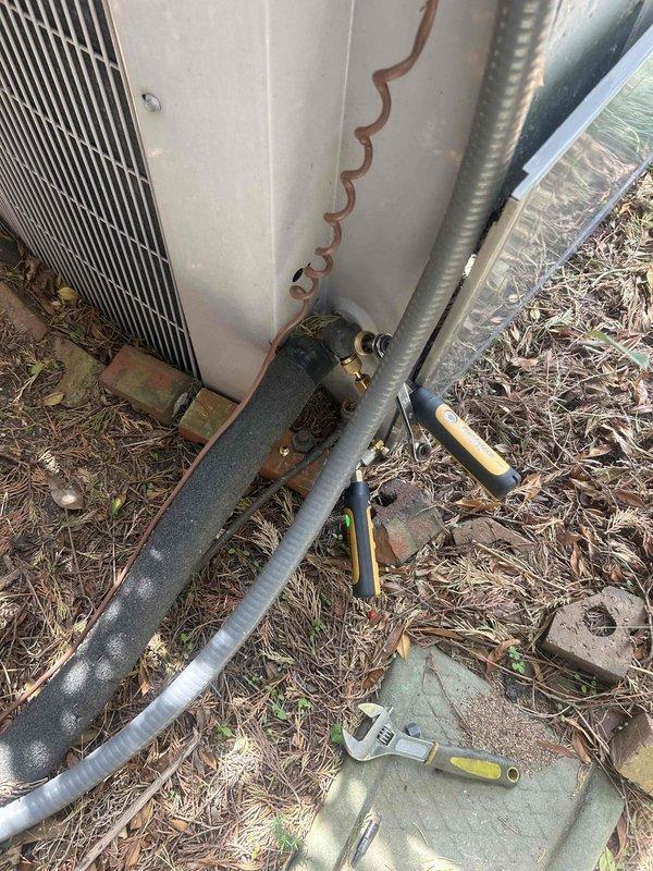 Responded to no heat call with complaint of outdoor unit making loud unusual noise. Upon arrival, measured supply air temperature at 79.5°F, confirming lack of heating. Inspected outdoor heat pump unit and found deteriorated refrigerant line insulation and loose copper refrigerant piping creating vibration and noise during operation. Secured refrigerant lines and recommended insulation replacement to prevent future efficiency loss and continued noise issues.