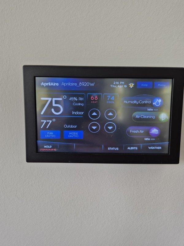 Responded to no cooling complaint on residential HVAC system. Upon arrival, found thermostat calling for cooling with indoor temperature at 75°F and setpoint at 74°F, but system not maintaining desired temperature. Inspected outdoor unit and identified worn compressor hard start capacitor with visible corrosion on refrigerant line connections. Replaced failed hard start component and verified proper compressor operation. System restored to normal cooling operation with satisfactory temperature differential.