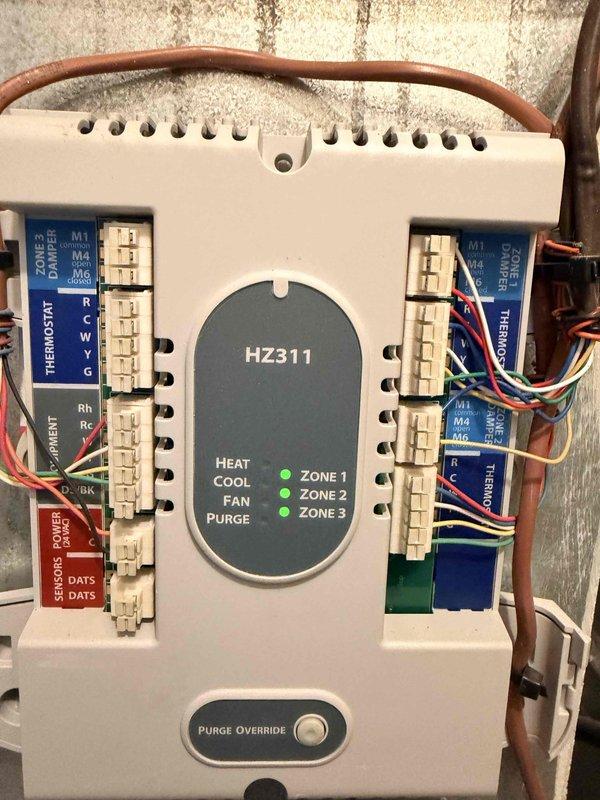 Conducted replacement estimate for HVAC system in two-story townhouse. Evaluated existing equipment located on second floor in closet adjacent to bathroom, including multi-zone Honeywell HZ311 control panel with three-zone configuration. Documented current system components, zone controls, and installation configuration to provide comprehensive replacement recommendations.