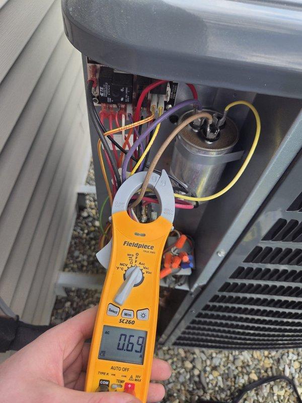 Completed preventive maintenance cooling inspection on first of two HVAC systems. Performed comprehensive electrical diagnostics using clamp meter to measure amperage draw on outdoor condensing unit. Accessed electrical compartment and tested capacitor, contactor, and associated wiring connections. Verified proper current readings at 0.59 amps during diagnostic testing. Inspected all electrical components including capacitor, relay, and wire terminations for signs of wear or damage. All components operating within normal parameters. System tested and confirmed operational. Unit left in proper working condition. Second system inspection to follow as part of scheduled maintenance visit.