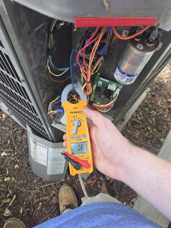 Completed cooling maintenance visit on two HVAC systems, including one ductless unit. Performed electrical diagnostics on outdoor condensing unit using clamp meter, verifying amperage draw and system performance. Inspected internal components including capacitor, wiring connections, and control board for proper operation and wear.