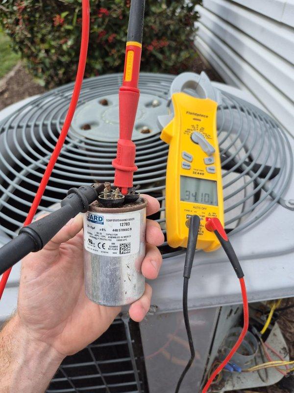 Completed routine cooling maintenance visit on residential air conditioning system. Performed comprehensive inspection of outdoor condenser unit, tested capacitor with digital multimeter confirming proper operation at 34.10 microfarads, and verified compressor motor functionality. Clarified air filter sizing discrepancy with homeowner, confirming unit requires 4-inch filter rather than previously stated 5-inch size.