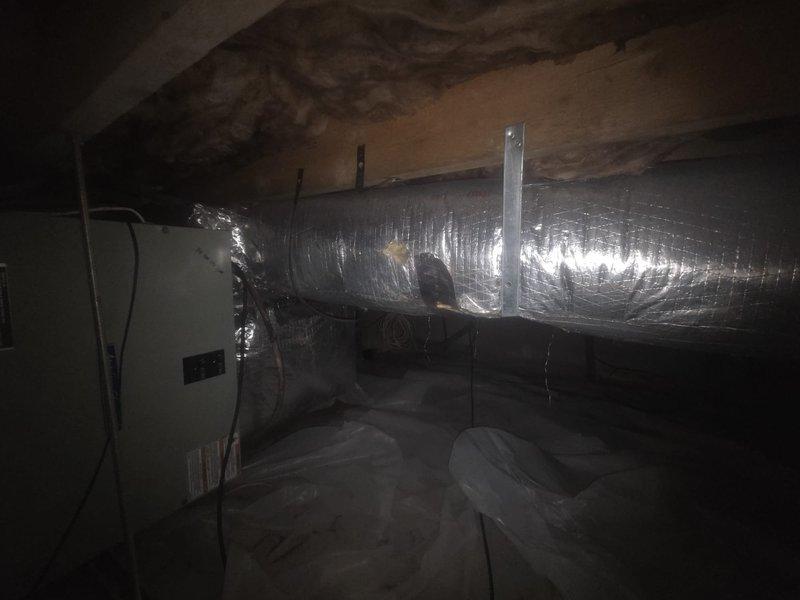 Removed damaged fiberglass ductboard trunk duct from attic and replaced with new insulated metal trunk duct system including reducers and dampered collars to improve upstairs airflow. Relocated improperly positioned supply connection from end cap to side of duct per proper installation standards. Replaced all flex runs and reused existing boots and registers to complete the ductwork upgrade.