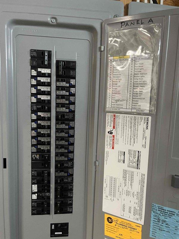 Completed routine cooling maintenance visit on multi-system property. Inspected outdoor condenser unit, verified proper operation, and documented electrical panel configuration. All systems operating within normal parameters with no deficiencies noted at time of service.