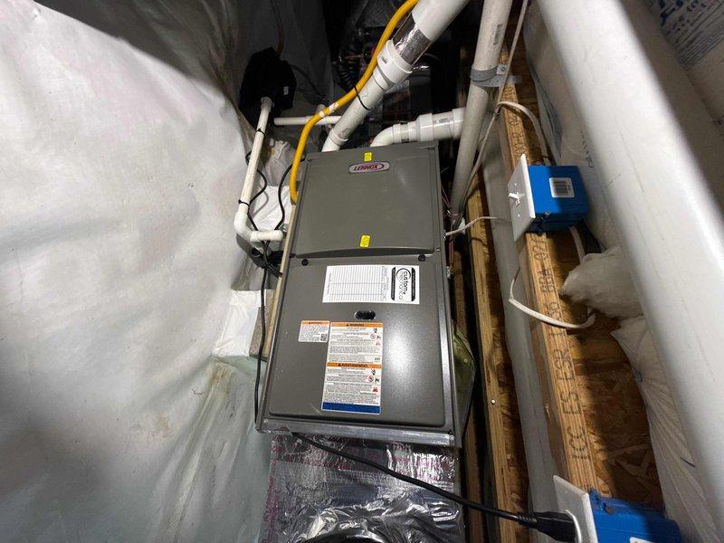 Completed full HVAC system replacement including removal and disposal of existing equipment. Installed ML193UH070EX single-stage furnace with LP conversion kit in horizontal configuration within crawl space, ensuring proper clearances and structural support. Mounted ML14KC1-030 2.5-ton 14.3 SEER air conditioning unit on outdoor platform with electrical whip and disconnect box. Installed CK40HT-030B horizontal evaporator coil and connected refrigeration lines. Performed complete system flush, pressure testing, and refrigerant charge to manufacturer specifications. Verified static pressure readings at 10.16 inches water column, confirming proper airflow and system balance. Installed TH6320WF Wi-Fi thermostat with complete system programming and connectivity setup. All PVC condensate and vent piping properly secured and routed. System startup completed with all safety controls verified operational. Customer enrolled in one-year maintenance agreement for ongoing system care.
