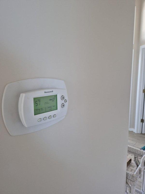 Responded to no heat call for multi-zone system with WiFi thermostats. Found lower zone thermostat not communicating with remote access system. Verified thermostat operation showing 57-59°F indoor temperature, confirmed power and display functioning properly, and troubleshot network connectivity issue preventing remote monitoring of bottom zone on 4-zone, 2-system configuration.