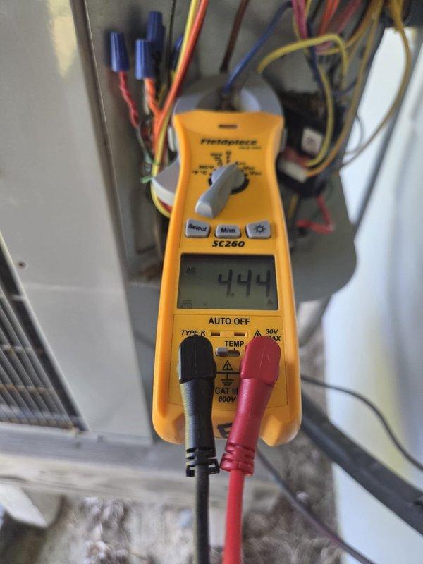 Completed scheduled cooling maintenance on two HVAC systems. Performed comprehensive inspections of both units, including temperature differential measurements across supply ductwork in attic space and electrical diagnostics at system controls. Measured voltage readings at 444V on system components to verify proper electrical operation. Inspected ductwork insulation for condition and integrity, noting typical wear patterns on reflective insulation wrapping. Verified proper airflow through supply plenums and checked filter locations per homeowner specifications. Both systems operating within normal parameters with no immediate service needs identified.