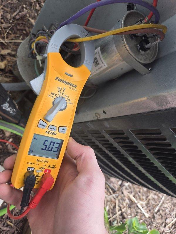 Completed routine cooling maintenance visit on residential HVAC system. Performed electrical diagnostics using clamp meter, recording compressor amperage at 503 amps, and verified capacitor connections and terminal integrity. Measured supply air temperature at 83.5°F and observed normal condensation formation on insulated refrigerant lines, indicating proper system operation. All components functioning within manufacturer specifications with no deficiencies noted.