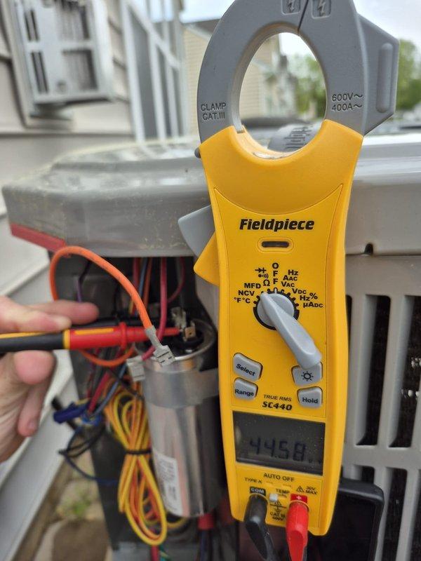 Completed scheduled cooling maintenance visit on HVAC system. Performed electrical diagnostics using clamp meter on control panel, measuring current draw at 446.0 amps to verify compressor and system operation within manufacturer specifications. Verified Honeywell ProSeries thermostat programming and functionality, confirming proper communication between thermostat and cooling equipment with setpoint at 72°F in heat mode and fan set to auto operation. All electrical connections in control panel inspected and found secure with no signs of overheating or damage. System operating normally with no deficiencies noted.