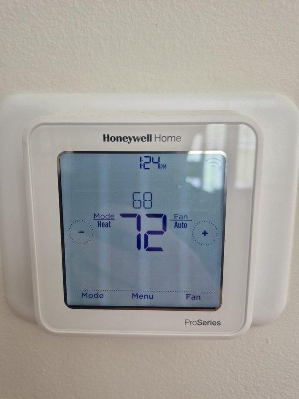 Completed scheduled cooling maintenance visit on HVAC system. Performed electrical diagnostics using clamp meter on control panel, measuring current draw at 446.0 amps to verify compressor and system operation within manufacturer specifications. Verified Honeywell ProSeries thermostat programming and functionality, confirming proper communication between thermostat and cooling equipment with setpoint at 72°F in heat mode and fan set to auto operation. All electrical connections in control panel inspected and found secure with no signs of overheating or damage. System operating normally with no deficiencies noted.