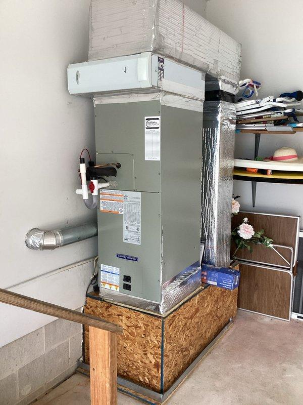 Completed full HVAC system replacement including removal and disposal of existing equipment. Installed 3-ton 14.3 SEER heat pump outdoor unit (model 5A6H4036) on existing stand and standard fan coil unit with 15KW electric heater and breaker (model 5TEM4B03) on existing wood platform in garage. Mounted Honeywell T-6 WiFi thermostat (model TH6320WF2003) for system control. Flushed, pressure tested, and recharged refrigeration lines to manufacturer specifications. System tested and verified operational with one-year extended warranty coverage from installation date.