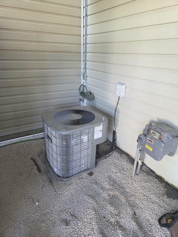 Performed cooling system preventative maintenance inspection on outdoor cylindrical condenser unit. Used clamp meter to verify electrical current draw and system amperage, confirming proper operation of compressor and fan motor. All electrical connections tested and found within normal operating parameters.
