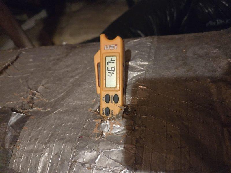 Performed routine maintenance on cooling system, including temperature and airflow diagnostics in attic space. Measured supply and return air temperatures using calibrated digital instruments, recording readings at flexible ductwork and insulated metal duct sections. System operating within normal parameters with no deficiencies noted.