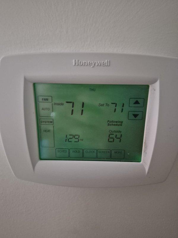 Completed scheduled cooling maintenance visit on residential HVAC system. Verified thermostat operation showing 71°F inside temperature with system following programmed schedule correctly. Performed electrical diagnostics using clamp meter at outdoor condensing unit, measuring amperage draw of 6.76 amps with system operating within normal parameters. All electrical connections at terminal block inspected and found secure with proper wire routing. System tested and confirmed cooling operation satisfactory.