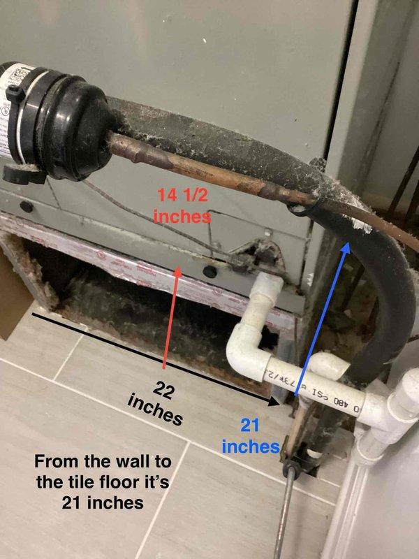 Responded to no cooling complaint on residential HVAC system. Upon arrival, inspected outdoor condenser unit and indoor air handler components. Found system operational issues requiring attention. Documented equipment condition with measurements showing 14.5-inch copper line extension, 22-inch unit width, and 21-inch clearance from wall to floor. Photographed outdoor condenser unit showing typical wear on copper coil grille and documented electrical disconnect box installation. Addressed cooling system malfunction and restored normal operation under existing service agreement terms.
