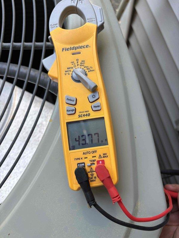 Completed scheduled cooling system preventive maintenance check. Performed electrical diagnostics using clamp meter, recording amp draw of 43.77A and temperature reading of 50.2°F at the outdoor condensing unit. Inspected condenser coil, refrigerant lines, and electrical connections. All components operating within normal parameters. System tested and left in proper working condition.