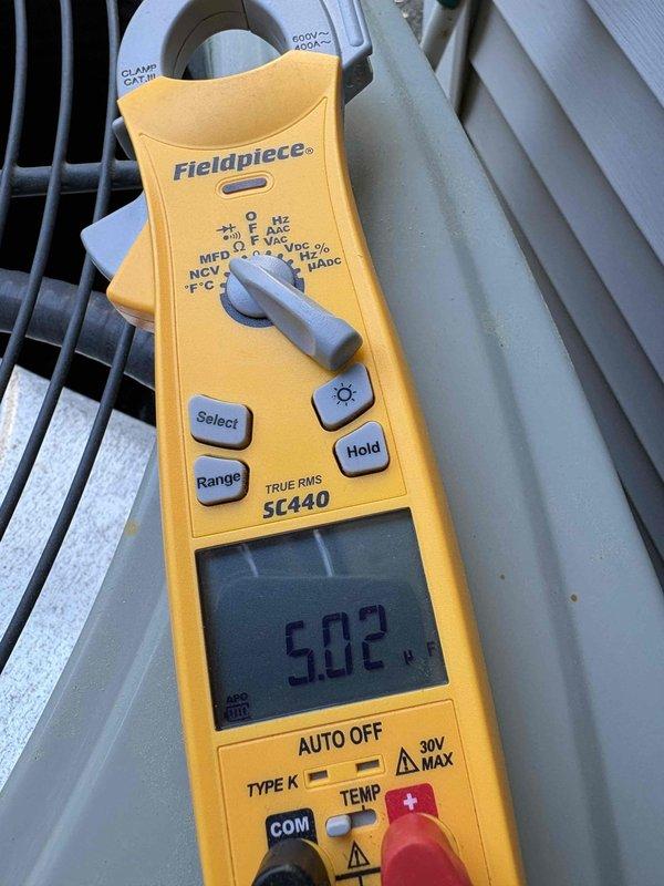 Completed scheduled cooling system preventive maintenance check. Performed electrical diagnostics using clamp meter, recording amp draw of 43.77A and temperature reading of 50.2°F at the outdoor condensing unit. Inspected condenser coil, refrigerant lines, and electrical connections. All components operating within normal parameters. System tested and left in proper working condition.