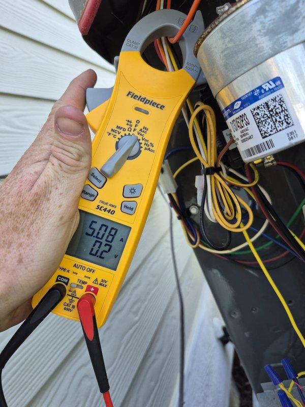 Completed routine cooling maintenance visit on two HVAC systems. Performed comprehensive diagnostics using clamp meter to verify electrical readings and system performance. Measured amperage draws and voltage levels at outdoor condensing units to ensure proper operation. Inspected electrical connections, capacitors, and wiring at both systems. All components tested within normal operating parameters. Systems operating efficiently with no issues found. Documentation photos captured of diagnostic readings during service.
