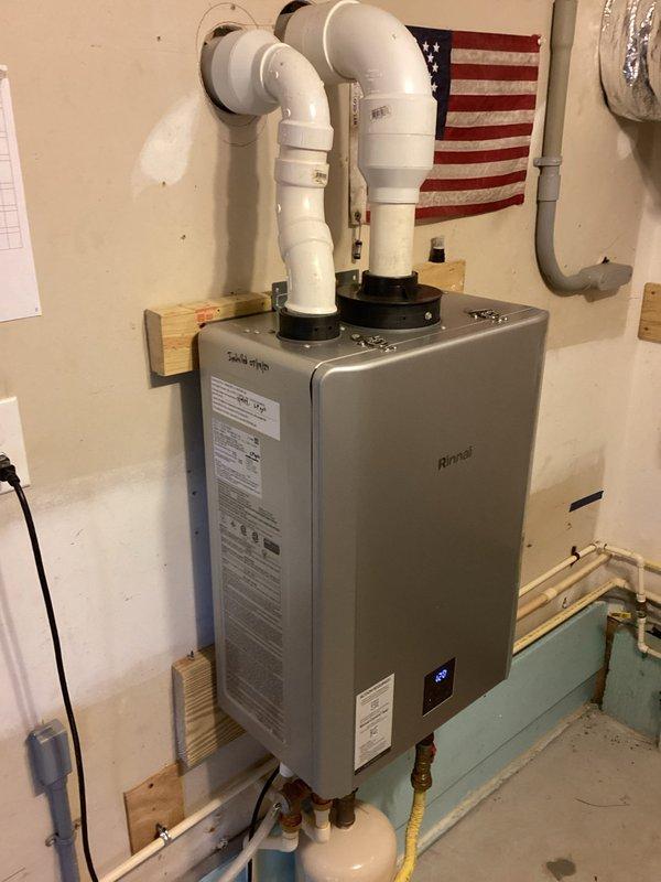 Performed routine maintenance flush on wall-mounted Rinnai tankless water heater system. Descaled unit using manufacturer-approved cleaning solution circulated through the heat exchanger to remove mineral buildup and ensure optimal performance. Inspected all plumbing connections, gas line, expansion tank, and isolation valves for proper operation and confirmed system functionality upon completion.