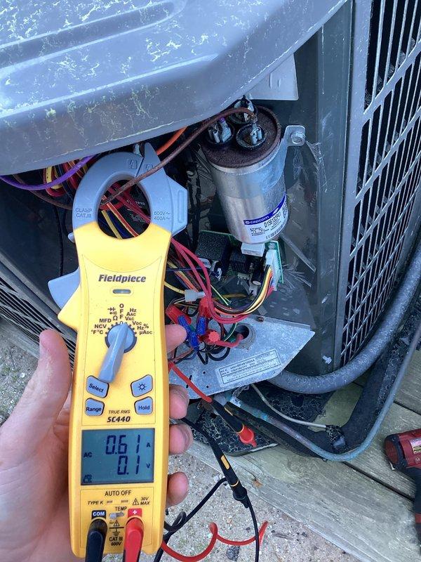 Performed spring maintenance on residential cooling system. Conducted electrical diagnostics using digital multimeter, measuring voltage and amperage at capacitor terminals. Inspected dual-run capacitor (25/5 MFD rating), contactor assembly, and associated wiring connections. Documented capacitor installation date and verified proper electrical values. All components operating within normal parameters; unit tested and confirmed operational.