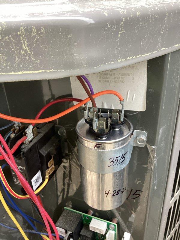 Performed spring maintenance on residential cooling system. Conducted electrical diagnostics using digital multimeter, measuring voltage and amperage at capacitor terminals. Inspected dual-run capacitor (25/5 MFD rating), contactor assembly, and associated wiring connections. Documented capacitor installation date and verified proper electrical values. All components operating within normal parameters; unit tested and confirmed operational.