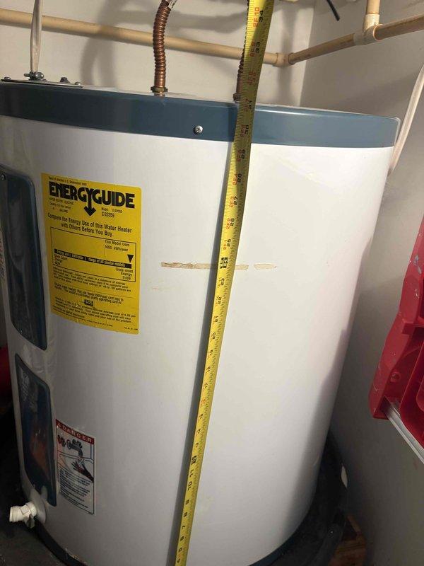 Completed comprehensive HVAC system inspection and tune-up service. Accessed attic space to evaluate ductwork system, inspected galvanized metal supply duct and PVC condensate drain line for proper installation and function. Documented water heater condition and verified proper clearances and safety equipment accessibility in mechanical room. All system components found operating within normal parameters with no immediate service concerns identified.