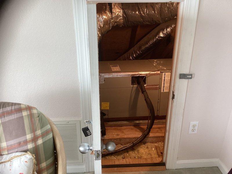 Performed on-site assessment of 16-year-old upstairs HVAC system that was not operational. Documented existing air handler unit installed in attic space with connected flexible ductwork and refrigerant lines, and provided comprehensive replacement estimate for complete system changeout.