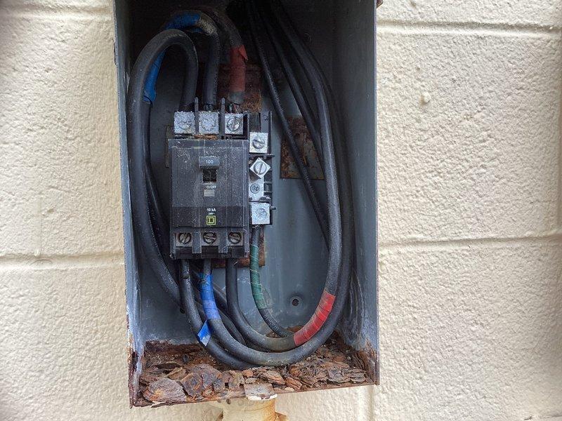 Completed full replacement of rooftop package HVAC unit. Removed existing aged unit and installed new package system on metal curb adapter with proper vibration isolation pads. Addressed electrical panel corrosion issues, cleared debris accumulation from enclosure, and ensured all electrical connections were properly terminated and secured with appropriate wire management.