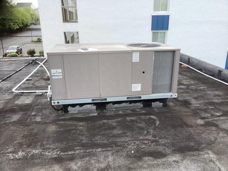 Completed full replacement of rooftop package HVAC unit. Removed existing aged unit and installed new package system on metal curb adapter with proper vibration isolation pads. Addressed electrical panel corrosion issues, cleared debris accumulation from enclosure, and ensured all electrical connections were properly terminated and secured with appropriate wire management.